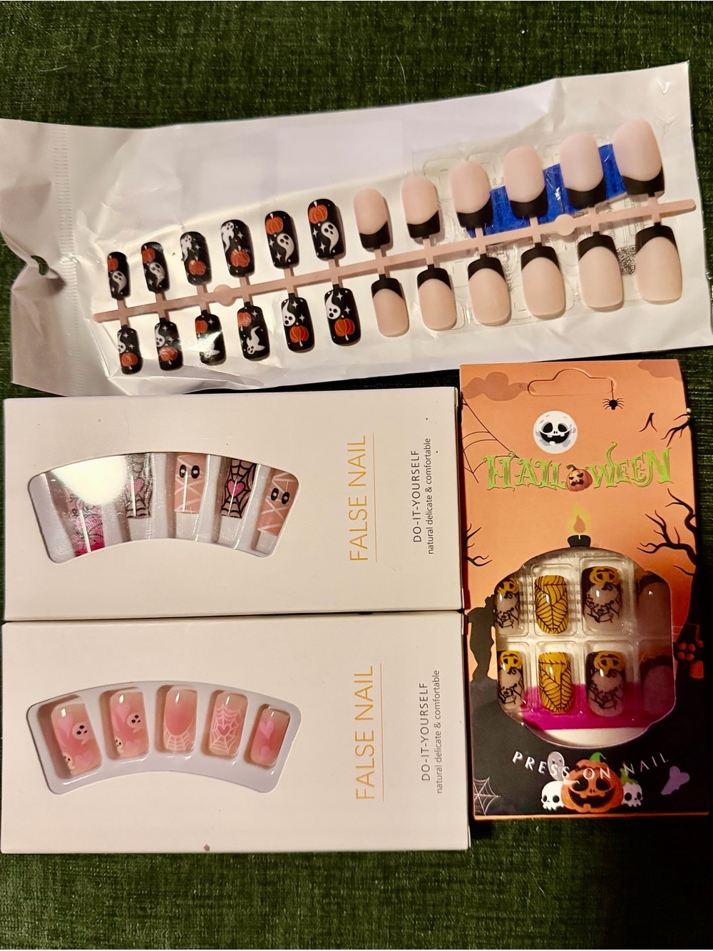 4 pairs of Halloween press on nails in various adorable patterns, new in boxy